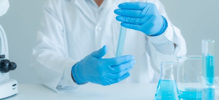 Scientist analyze biochemical sample in advanced scientific laboratory. Medical professional check...