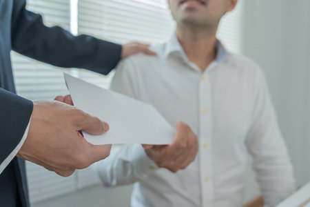 Businessmen receive salary or bonuses from management or Boss. Company give rewards to encourage work. Smiling businessman enjoying a reward at the desk in the office.の写真素材