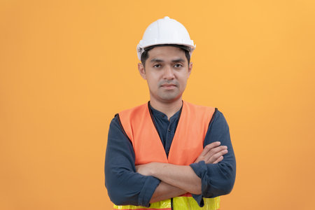 inspector, engineer, Foreman or contactor proudly crosses his arms to inspect the quality of his work. architects work to build the house before handing it over to the homeowner. Develop new estate.の写真素材