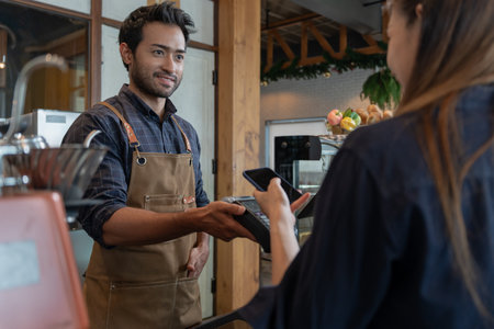 Woman use smartphone to scan QR code to pay in cafe restaurant with a digital payment without cash. Choose menu and order accumulate discount. E wallet, technology, pay online, credit card, bank app.の写真素材