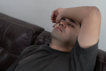 Depression and mental illness. Asian man disappoint, sad after receive bad news. Stressed boy confused with unhappy problem, arguing with girlfriend, cry and worry about unexpected work, down economy.の写真素材