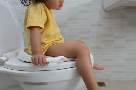 child going to the toilet, constipation in children, dyspepsia, abdominal pain, crying, defecating, straining, urinary incontinence, blood in the stool, bowel problems, ulcerative colitis, diarrheaの写真素材