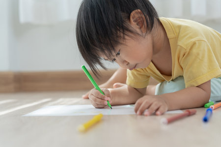 Happy Asia children playing learning paint on paper. Activity, development, IQ, EQ, meditation, brain, muscles, essential skills, family having fun spending time together. Holidayの写真素材