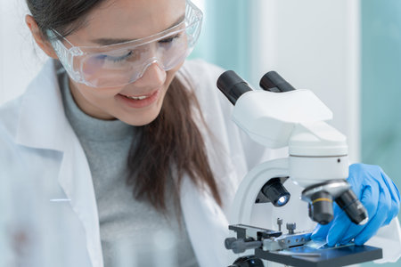 Scientist analyze biochemical samples in advanced scientific laboratory. Medical professional use...