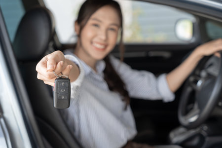 lease, rental car, sell, buy. Dealership manager send car keys to the new owner.  Sales, loan credit financial, rent vehicle, insurance,  renting, Seller, dealer, installment, car care businessの写真素材