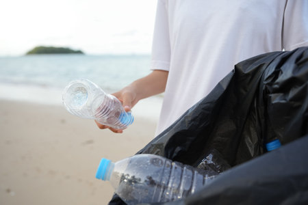 Save ocean. Volunteer pick up trash garbage at the beach and plastic bottles are difficult decompose...