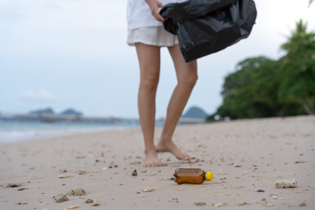 Save ocean. Volunteer pick up trash garbage at the beach and plastic bottles are difficult decompose prevent harm aquatic life. Earth, Environment, Greening planet, reduce global warming, Save worldの写真素材