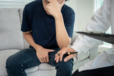 Man hold hand in front of private parts feeling discomfort and consult doctor. Venereal, testicular cancer. bladder problems, erectile dysfunction, premature ejaculation, prostate cancerの写真素材