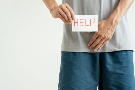 Man hold hand in front of private parts feeling discomfort from disease and inflammation. Venereal,...