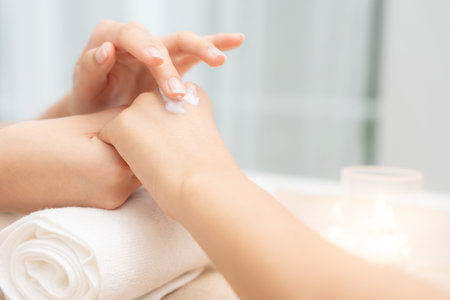 spa and treatment skin hand, Woman applying organic moisturizing hand cream, hand skin care concept, winter, female skin protection, beautiful woman skin care with hand cream, lotion on handsの写真素材