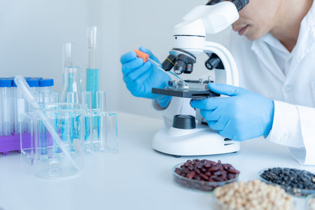 Scientist analyze biochemical samples in advanced scientific laboratory. Medical professional use...
