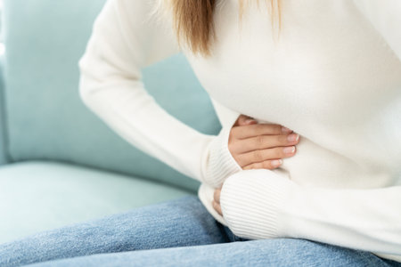 stomach ache. Asian women have abdominal pain, indigestion, gastritis, menstrual cramps, flatulence,...