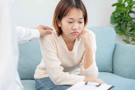 psychiatrist holds shoulders while discussing life and family issues. doctor encourages and empathy woman suffers depression. psychological, save divorce, Hand in hand together, trust, careの写真素材