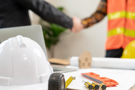 Construction team hands shaking greeting start up plan new project contract in office center at...