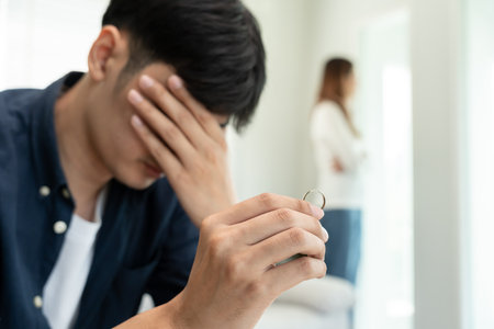 Divorce. Man remove married ring. Couples desperate and disappointed after marriage. Husband wife sad, upset and frustrated after quarrels conflict. distrust, love problems, betrayals, family, loverの写真素材