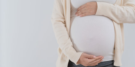 pregnant woman or Mother gently touches the baby on stomach. Happy, family, growth, pregnancy,...