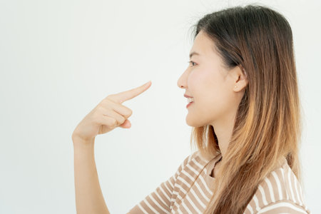 plastic surgery, beauty asian smile and happy after surgery, surgical procedure that involve altering shape of nose, doctor examines patient nose before rhinoplasty, medical assistance, healthの写真素材