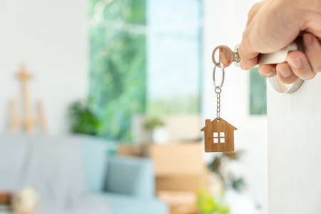 Moving house, relocation. The key was inserted into the door of the new house, inside the room was a...