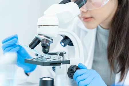 Scientist analyze biochemical samples in advanced scientific laboratory. Medical professional use...