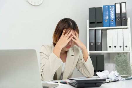 Debt business, Stressed and headache business asian woman analysis financial company problem. no money to pay, shortage, Financial problems, mortgage, loan, bankruptcy, bankrupt, poor, overdueの写真素材