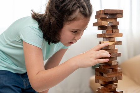playing learning games jan-ga with the little girl. Funny family is happy and excited in the house. mother and son having fun spending time together. holiday, weekend, vacant.の写真素材