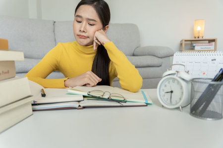 Asian student woman have anxiety because of exams, female prepare for test and learning lessons in...