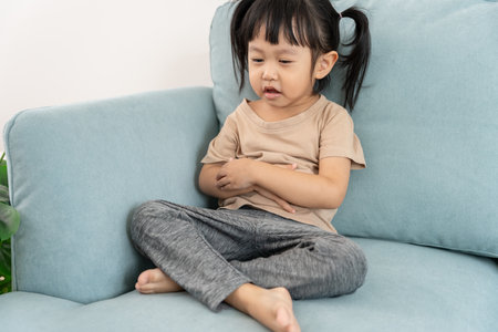 stomach ache. Children have abdominal pain, indigestion, gastritis, menstrual cramps, flatulence, diarrhea, distention, colon cancer, belly inflammation problem, suffer food poisoning, abdomenの写真素材