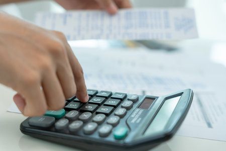 woman with large bills or invoices no money to pay to expenses and credit cardの写真素材