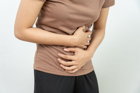 stomach ache. Asian women have abdominal pain, indigestion, gastritis, menstrual cramps, flatulence,...
