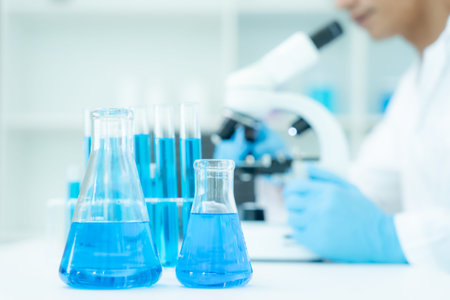 Scientist analyze biochemical samples in advanced scientific laboratory. Medical professional use...