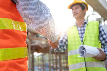 Construction team hands shaking greeting start up plan new project contract in office center at...