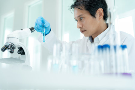 Scientist analyze biochemical sample in advanced scientific laboratory. Medical professional check chemical mix microbiological developmental of viral. Biotechnology research in science lab. cosmeticの写真素材