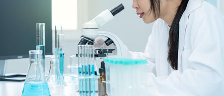 Scientist analyze biochemical samples in advanced scientific laboratory. Medical professional use...