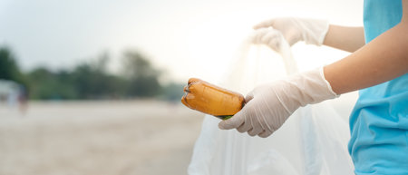 Save water. Volunteer pick up trash garbage at the beach and plastic bottles are difficult decompose prevent harm aquatic life. Earth, Environment, Greening planet, reduce global warming, Save worldの写真素材