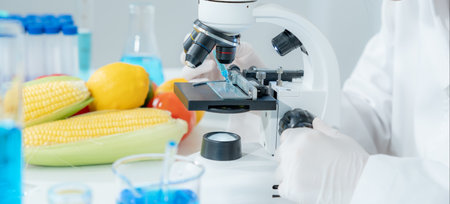 Scientist check chemical food residues in laboratory. Control experts inspect quality of fruits, vegetables. lab, hazards, ROHs, find prohibited substances, contaminate, Microscope, Microbiologistの写真素材