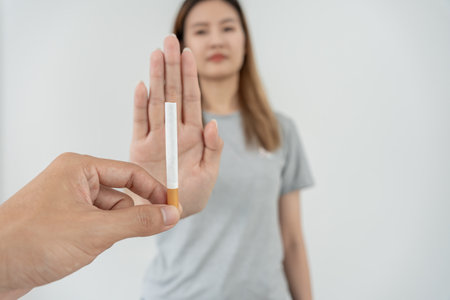 No smoking. Woman stop smoke, refuse, reject, break take cigarette, say no. quit smoking for health. world tobacco day. drugs, Lung Cancer, emphysema , Pulmonary disease, narcotic, nicotine effectの写真素材