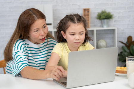 online tutor online course for Asian children. video conference on laptop at home. play back online...