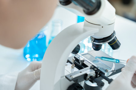 Scientist analyze biochemical samples in advanced scientific laboratory. Medical professional use...
