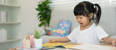 Happy Asian children relax read book at home. daughter and reading a story. learn development,...