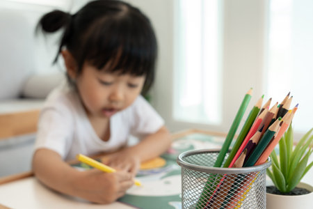 Happy children playing learning paint on paper. Activity, development, IQ, EQ, meditation, brain, muscles, essential skills, family having fun spending time togetherの写真素材