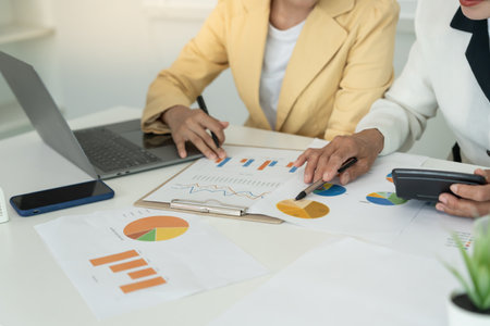 Business team calculate benefit, working woman, spreadsheets, graph financial development, bank accounts, statistics, economy, data analysis, investment analysis, stock exchangeの写真素材