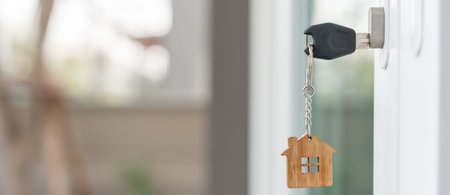 Key for unlocking house is plugged into the door. Second hand house for rent and sale. keychain is...