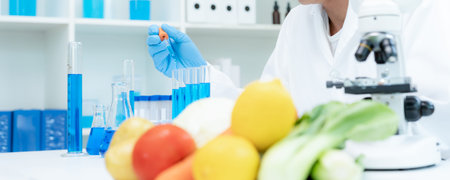 Scientist check chemical food residues in laboratory. Control experts inspect quality of fruits,...