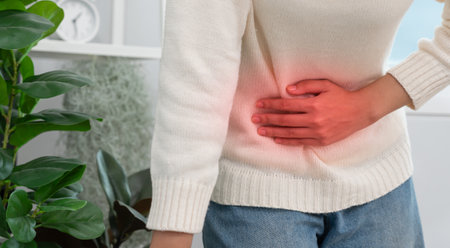 stomach ache. Asian women have abdominal pain, indigestion, gastritis, menstrual cramps, flatulence, diarrhea, distention, belly inflammation problem,の写真素材