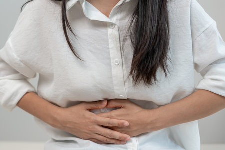 stomach ache. Asian women have abdominal pain, indigestion, gastritis, menstrual cramps, flatulence, diarrhea, distention, belly inflammation problem,の写真素材