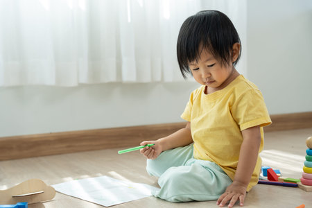 Happy Asia children learning and enjoy paint. family is happy and excited in the house. Mother and...