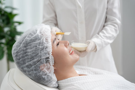 Beautiful woman receive spa and treatment skin of face. face of a healthy woman apply cream. Advertisement for skin cream, anti-wrinkle, baby face, whitening, moisturizer,の写真素材