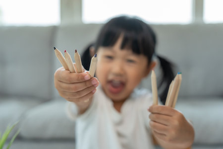 Little girl show pint, Happy children playing learn paint on paper. Activity, development, IQ, EQ, meditation, brain, muscles, essential skills, family having funの写真素材