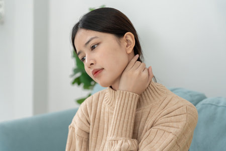 woman working in office with a carpal tunnel syndrome or wrist joint inflammation, hand muscle inflammation from office syndrome , hand muscle pain from workingの写真素材
