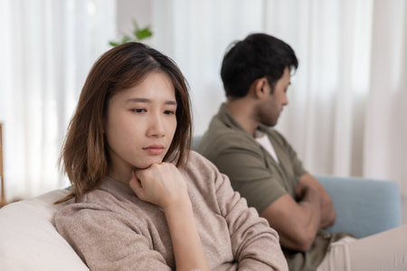 Divorce. Asian couples are desperate and disappointed after marriage. Husband and wife are sad, upset and frustrated after quarrels. distrust, love problems, betrayals.の写真素材